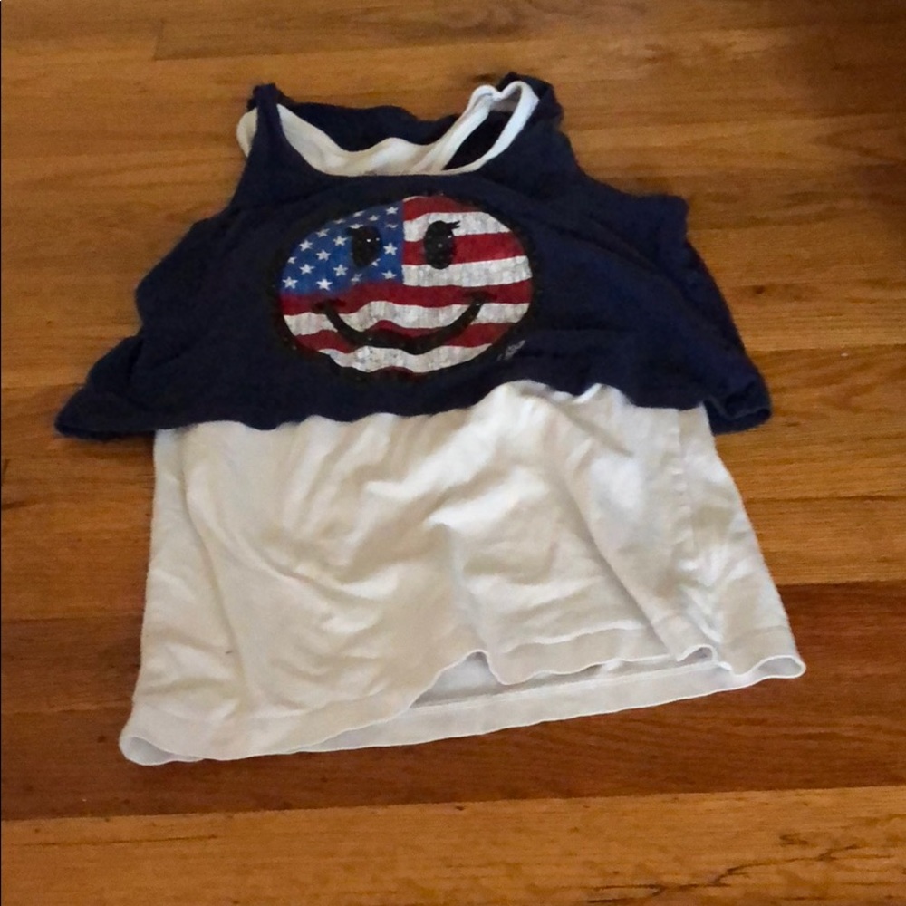 A blue and white two tiered smiley face tank top.